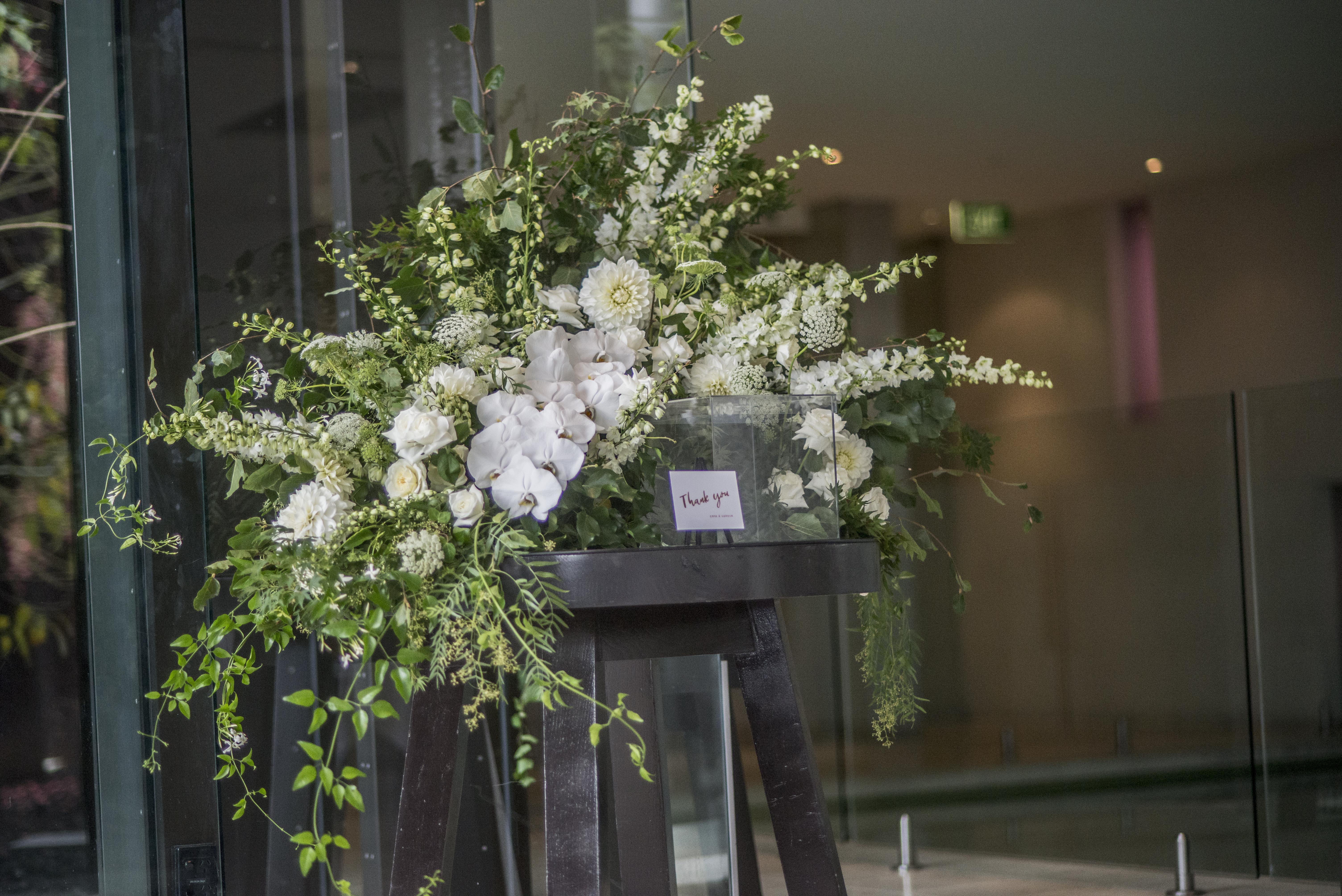 Feature wishing well floral instillation