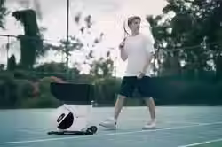 photo-of-a-male-tennis-play-with-pongbot-pace-s-pro-on-a-tennis-court