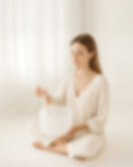 Lady playing a crystal sound bowl with a mallet