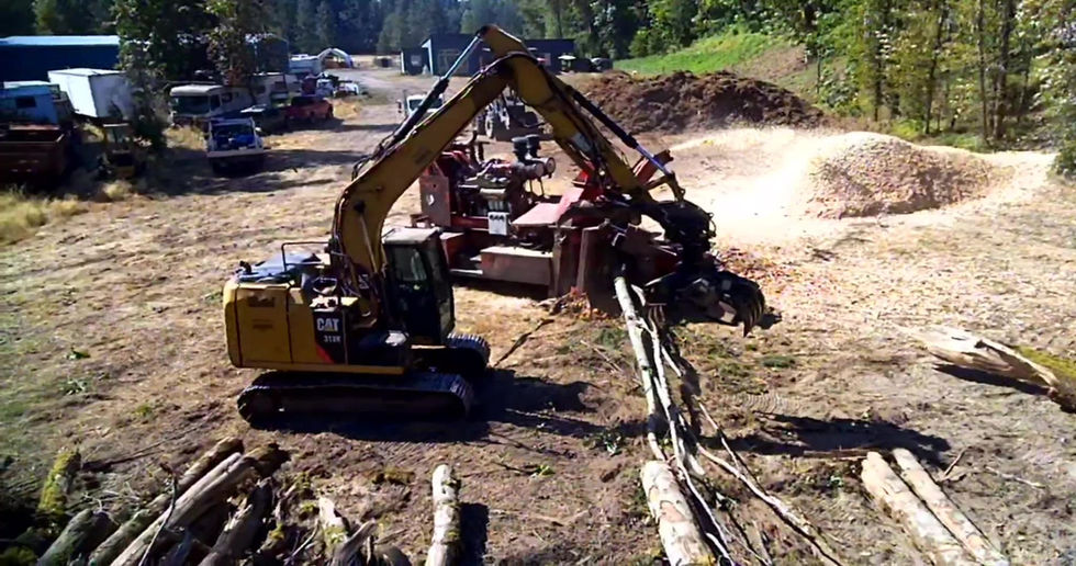 Morbark 30 whole-tree chipper producing mill-spec chips