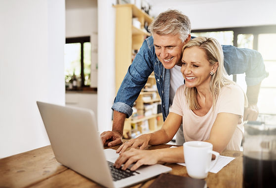 happy-smiling-mature-couple-using-laptop-together-home-charming-husband-assisting-wife-wit