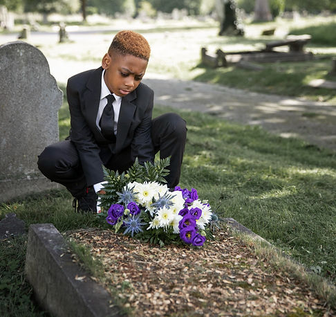 close-up-child-visiting-grave-loved-one_edited.jpg