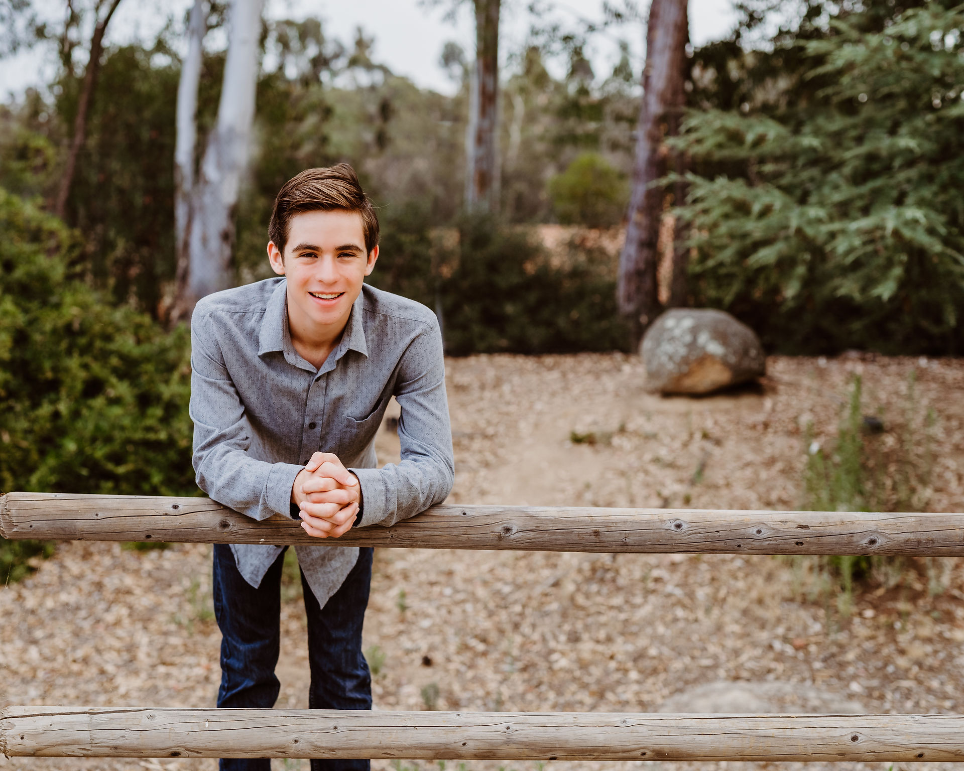 senior photos of a young man in a park in San Diego