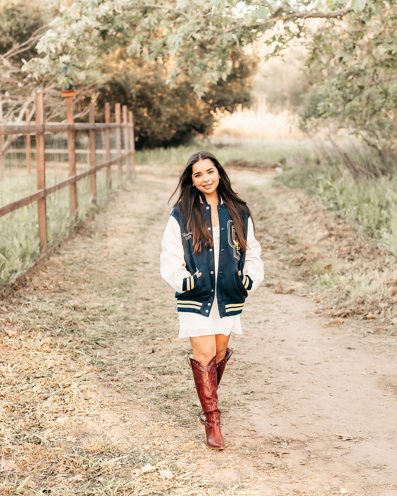 senior photos of a high school senior in a field in San Diego