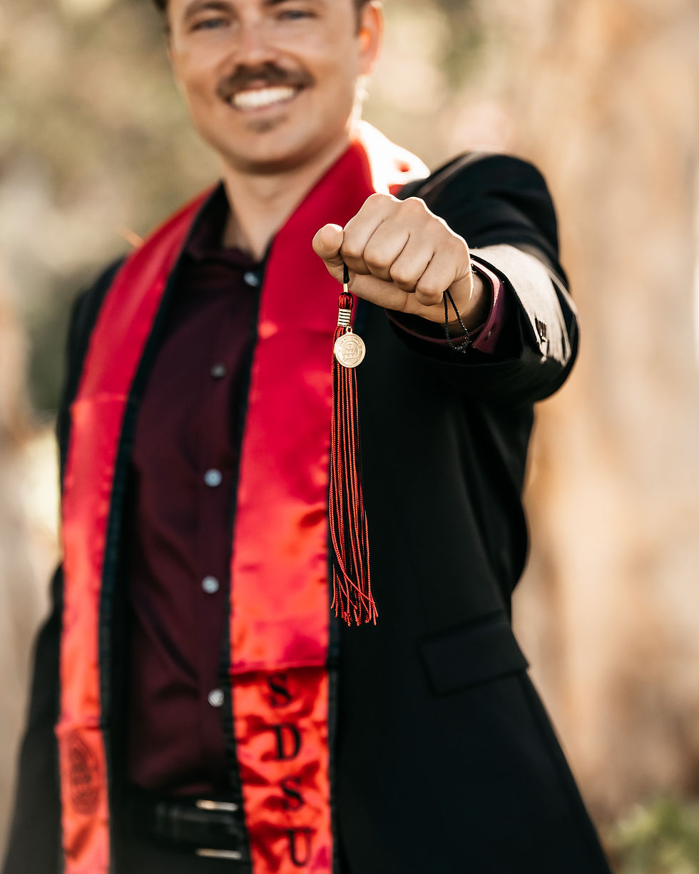 SDSU male graduate with tassel on campus