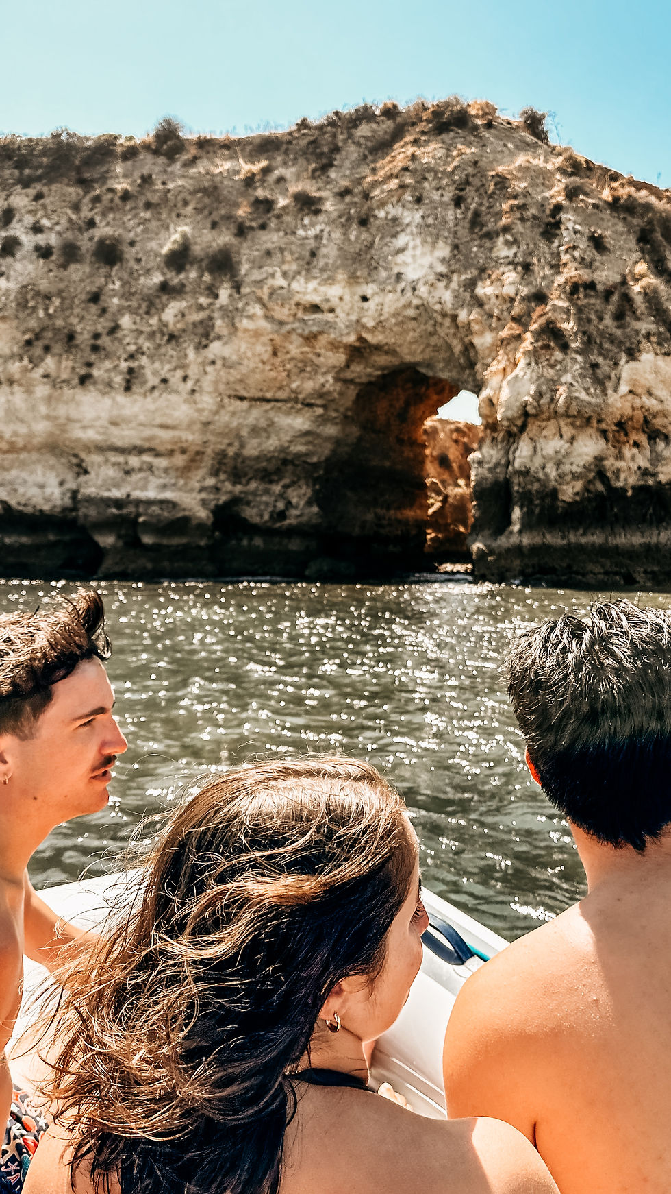 kids on a boat watching the shoreline mobile photography