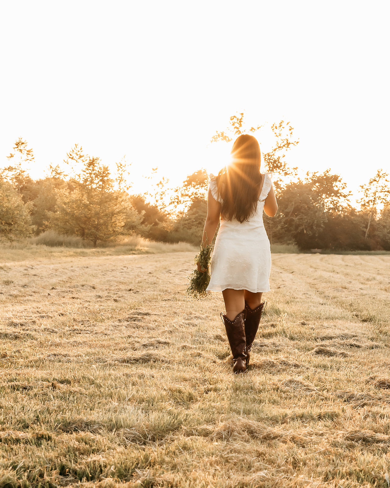 senior photos of a high school senior in a field