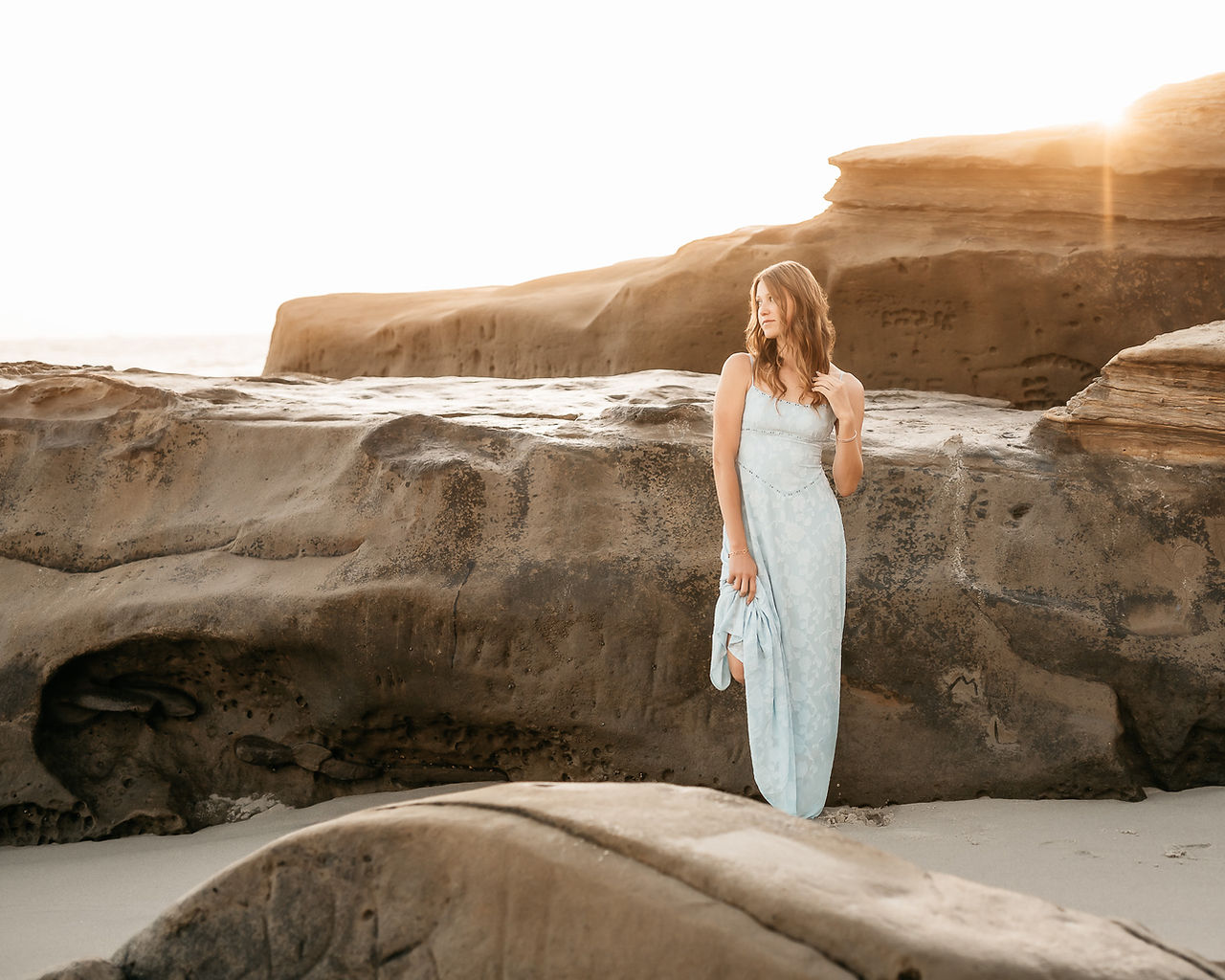 HS senior at beach in blue dress