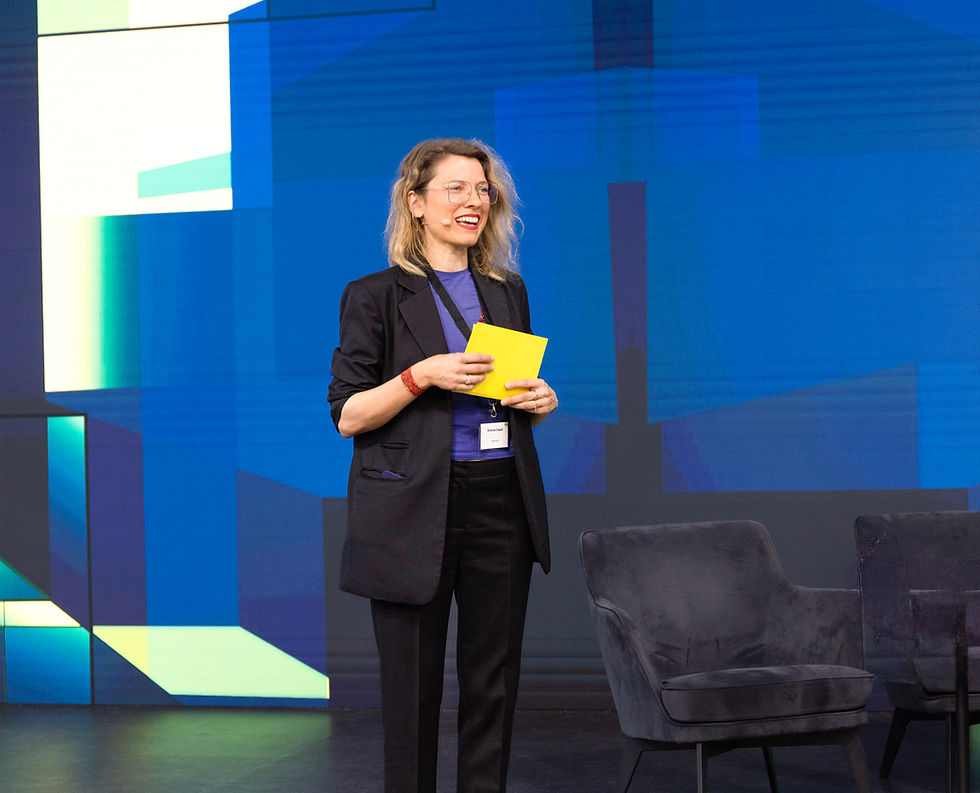 Kristine Capek speaking in front of audience