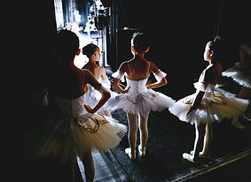 woman in white dress dancing on the stre