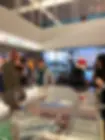 Pictures of Us smiling at an exhibit