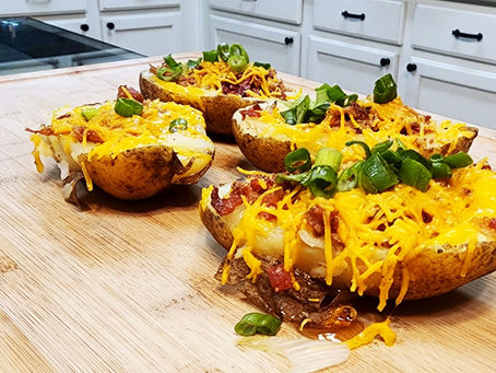 Smoked Pulled Pork Loaded Baked Potatoes | Hearty and Delicious