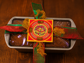 A Fobbie gift wrapping banana bread in a loaf pan.