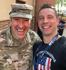 Adam celebrating the completion of the 9/11 stair challenge with Chief Weimer near Phoenix, Arizona.