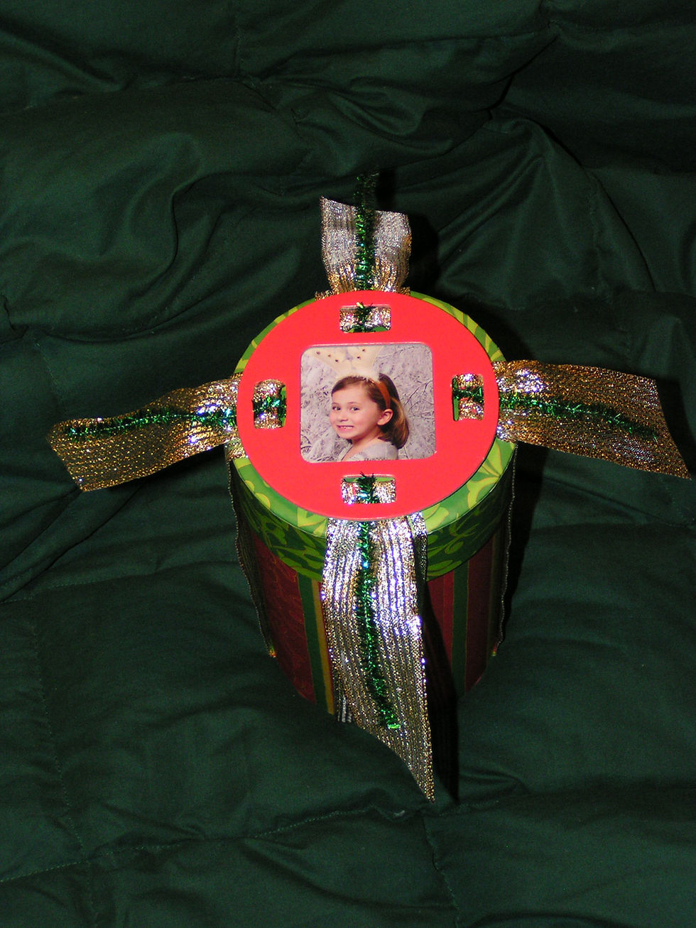 Young girl in a picture frame Fobbie for holiday gift wrapping.