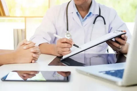 Healthcare billing specialist entering charges accurately for Illinois providers.