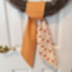 Orange and cream plaid side of the reversible wreath sash, classic pattern for Thanksgiving wreaths, autumn doors, and fall p