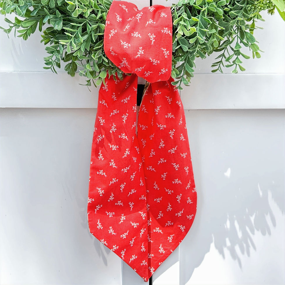 Thumbnail: Cream poinsettia and watermelon red reversible wreath sash tied on evergreen wreath, Christmas front door decor