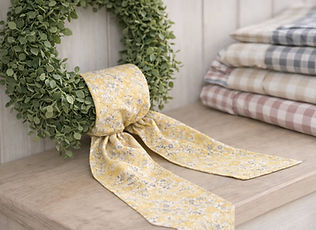 Fresh-landing wreath sash tied in a simple knot on a boxwood wreath.jpg