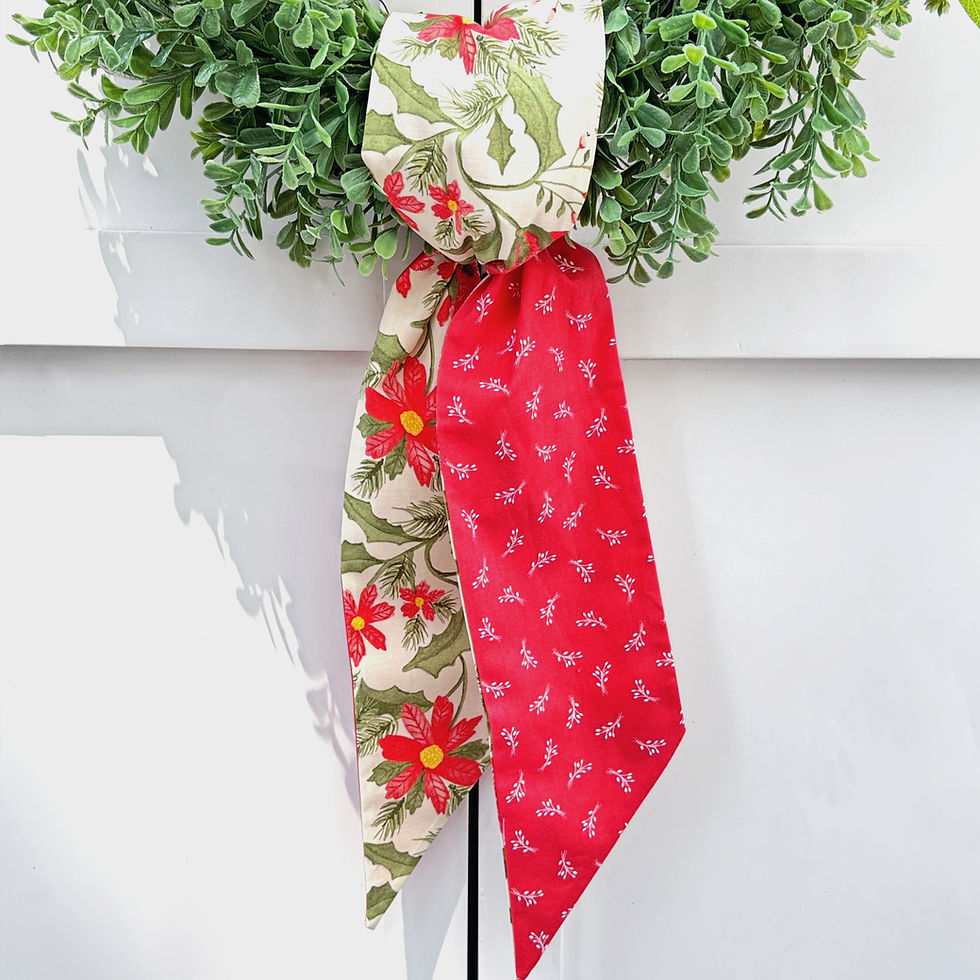 Thumbnail: Cream poinsettia and watermelon red reversible wreath sash tied on evergreen wreath, Christmas front door decor