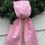 Thumbnail: The pink candy cane wreath sash displayed on a Christmas wreath against a white door, styled with winter greenery to create a