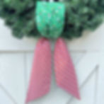 Reversible Seasonal Knot wreath sash with green Christmas lights and candy cane stripe fabrics.