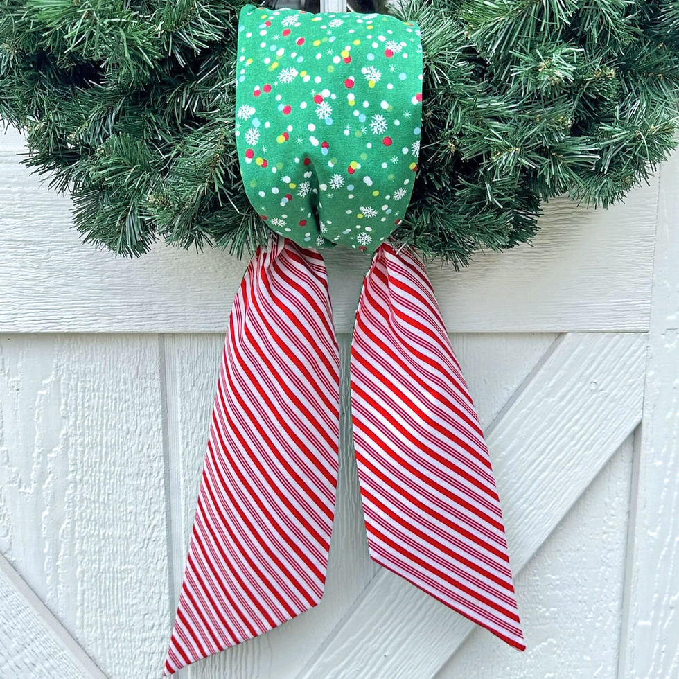 Reversible Seasonal Knot wreath sash with green Christmas lights and candy cane stripe fabrics.