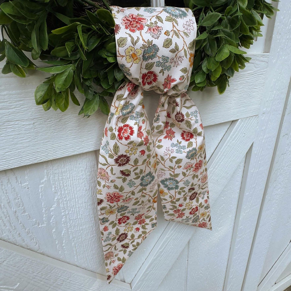 Thumbnail: Garden floral wreath sash displayed on green boxwood wreath against white door