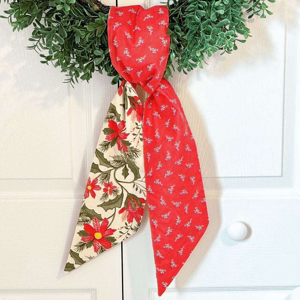 Thumbnail: Cream poinsettia and watermelon red reversible wreath sash tied on evergreen wreath, Christmas front door decor