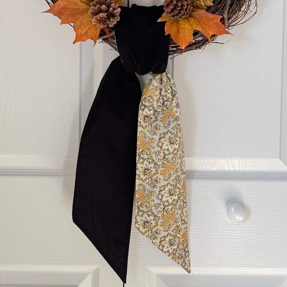 Thumbnail: Cream and black marigold floral wreath sash tied on pinecone wreath, fall front door decor