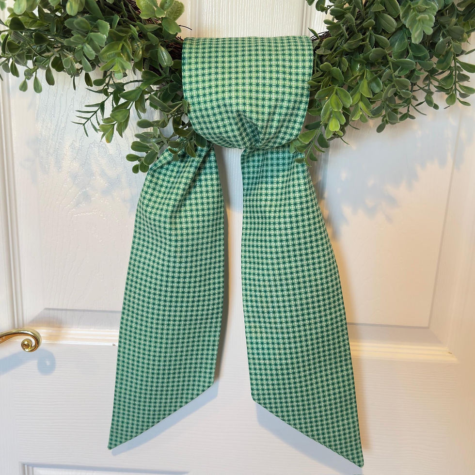 Thumbnail: Green Celtic cross wreath sash draped over a boxwood wreath on a front door, featuring embroidered Celtic cross detail.