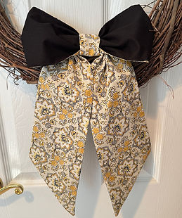 Black and gold floral reversible fabric knot again bow sash that can be styled as a fall wreath sash or grandmillennial bow