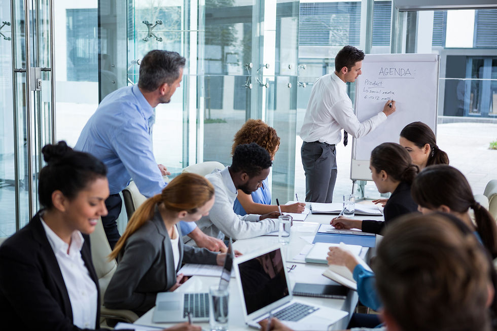 businessman-discussing-on-white-board-with-coworke-2026-01-11-10-31-16-utc.jpg