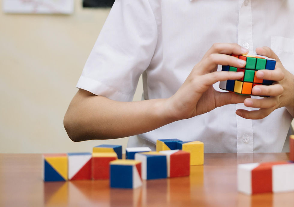 schoolboy-solving-puzzle-class