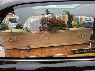 coffin in hearse.jpg