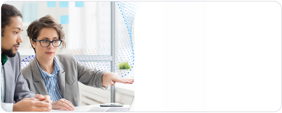 ISUMO team members looking at a laptop in a modern office setting