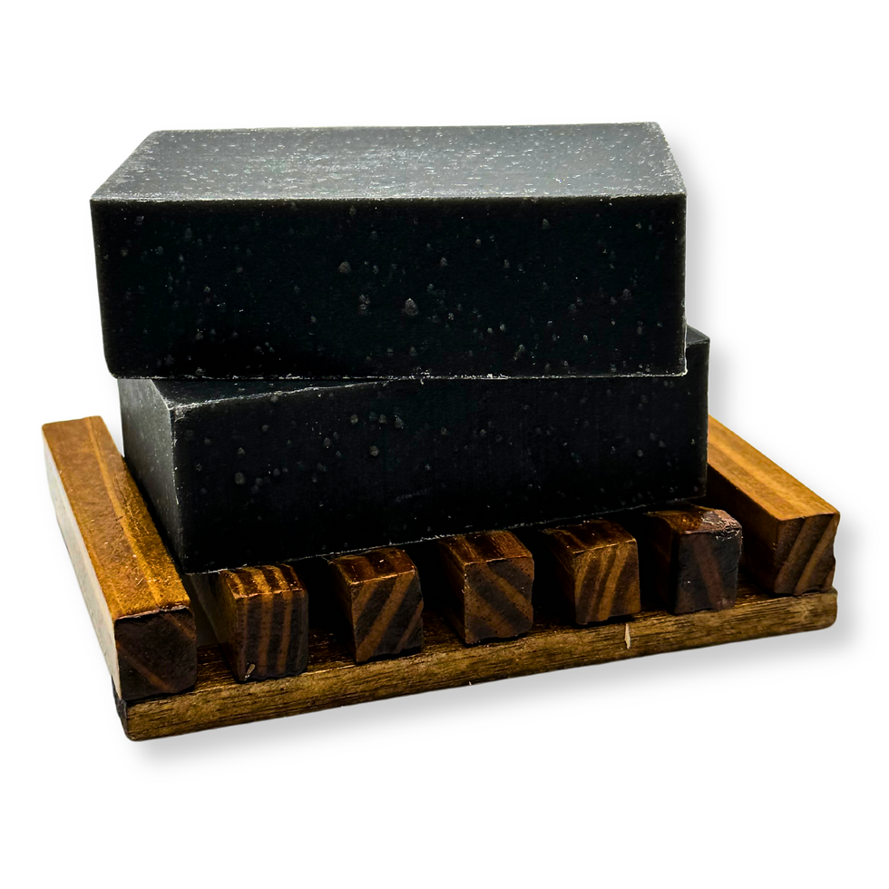 Yondr Natural Co. Black Tea Tree Plantain Leaf Natural Bar Soap. Emphasizing the rich, dark color and luxurious texture.