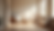 Sunlit room with three beige chairs, wood flooring, a table, and a vase with dried flowers. Warm ambiance with a bright window view.