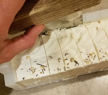 cutting a loaf of soap