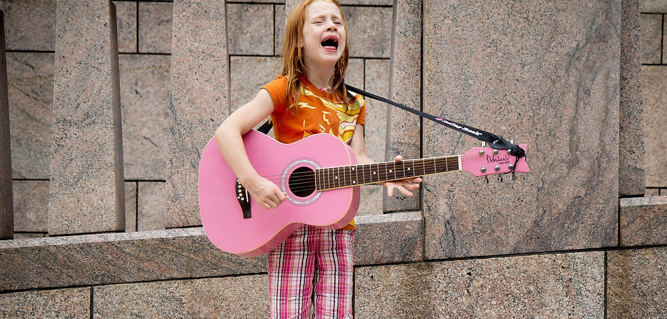 girl%2520playing%2520guitar%2520near%2520wall_edited_edited.jpg