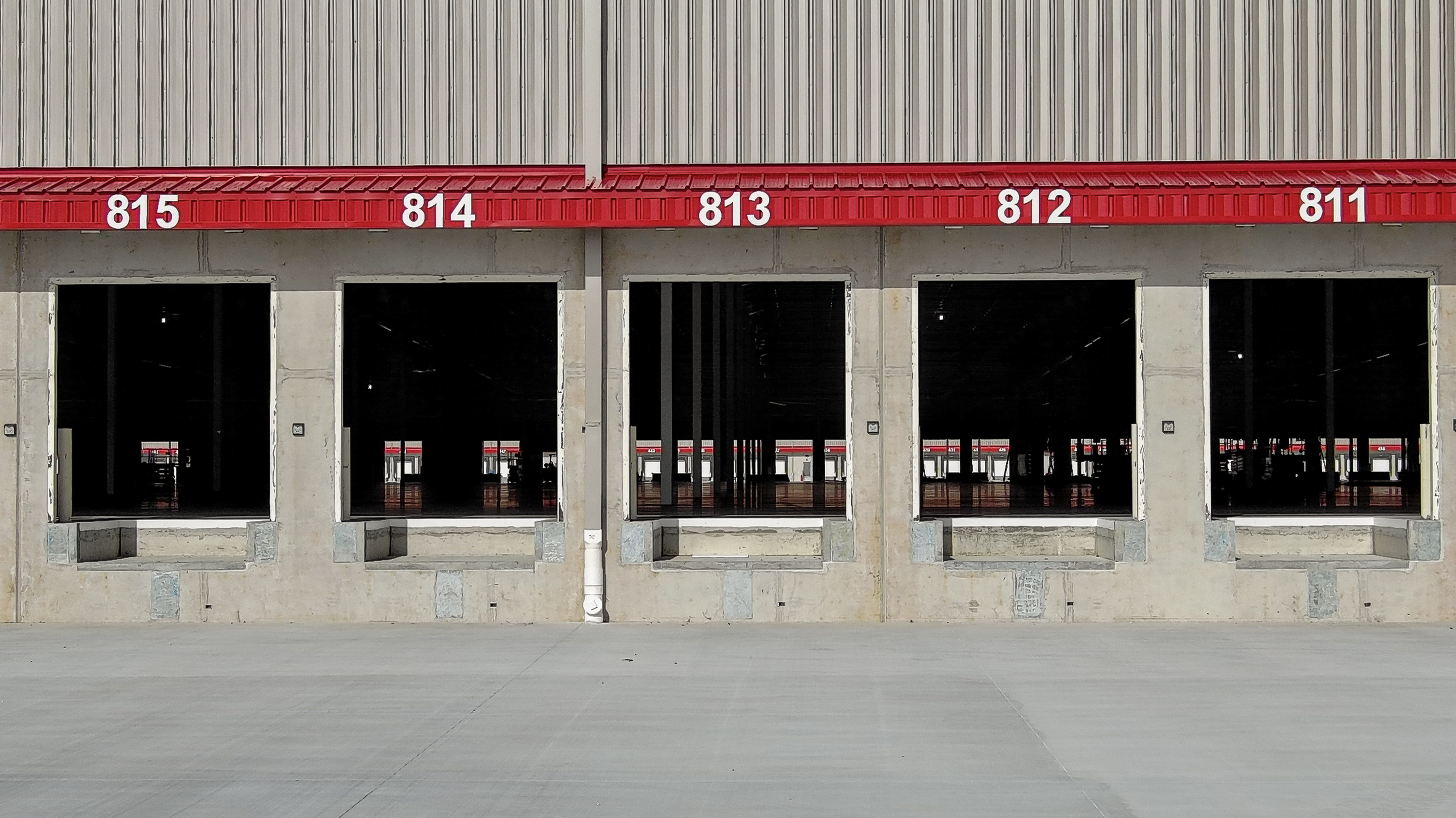 Exterior view of a commercial loading dock area documented through ground capture