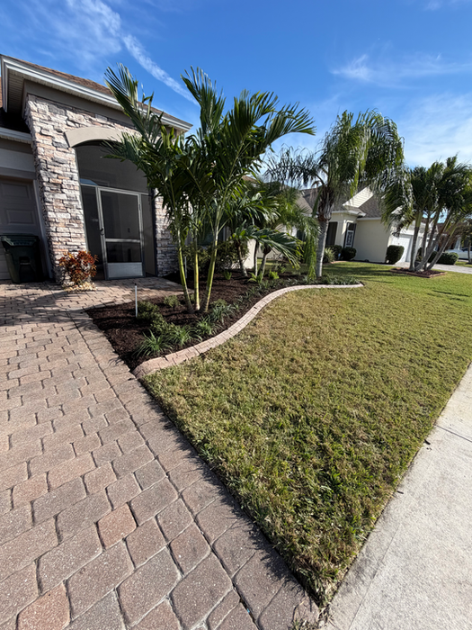 Paver walkway and landscape installation by M'Owen Your Lawn LLC Brevard County