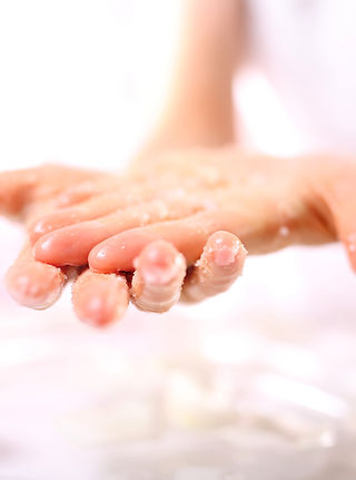 Cosmetic surgery, hand peeling.Massage of female hands peeling preparation Spa & Wellness.