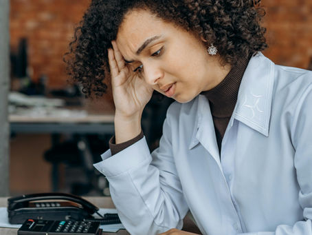 an-exhausted-woman-reading-files