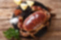 fresh Brown Crab (Cancer Pagarus) with spices for cooking close-up on the table. Horizonta