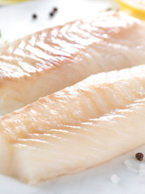 Fresh fish, raw cod fillets with addition of herbs and lemon .jpg