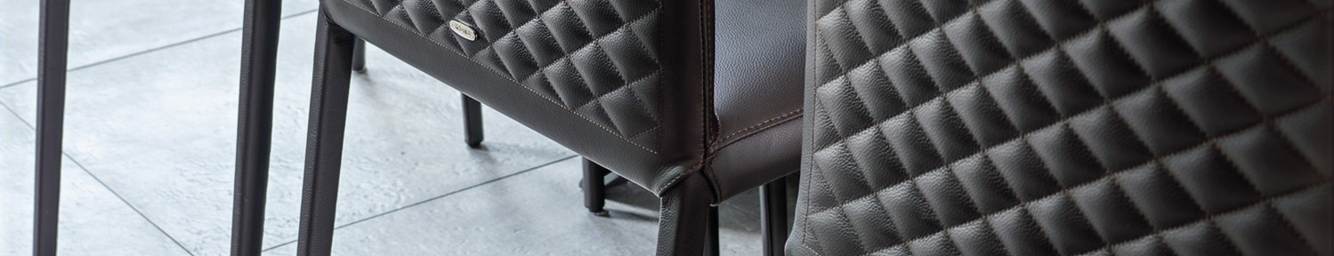 Brown leather chairs with stitching detail