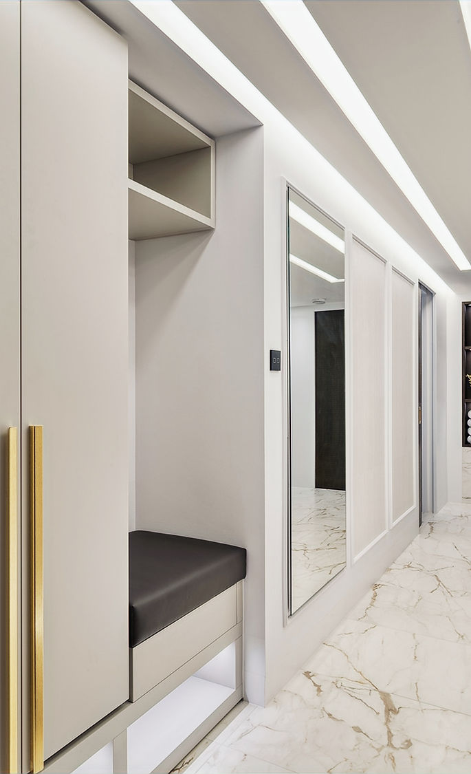Luxury bespoke Italian kitchen with marble-effect floor, integrated seating and refined contemporary joinery