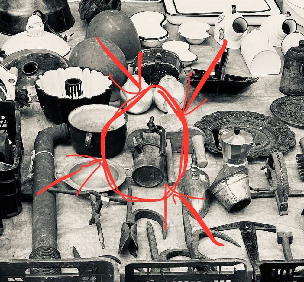Market tables in black and white, one object circled in red