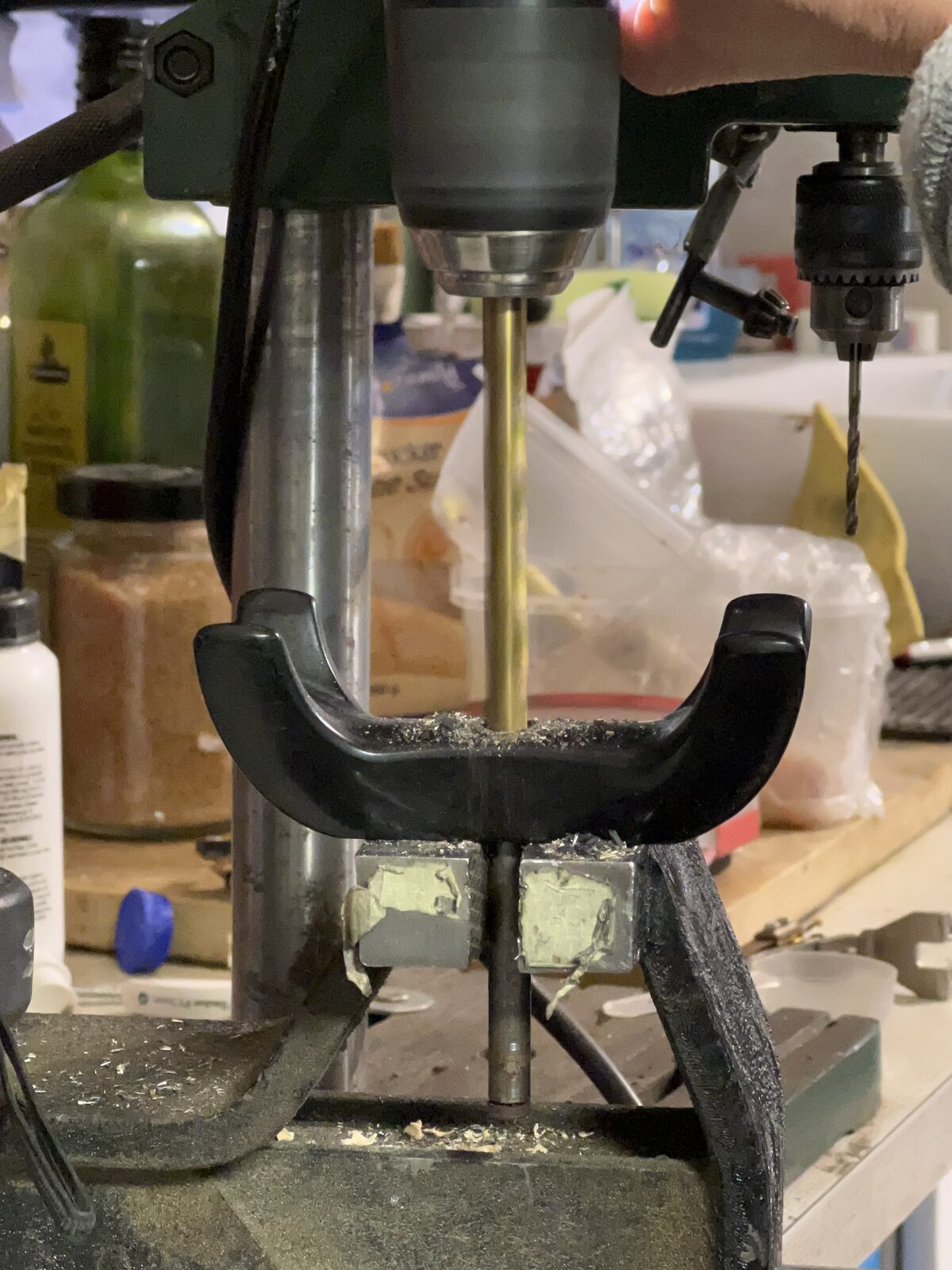 Handset cradle under the drill press